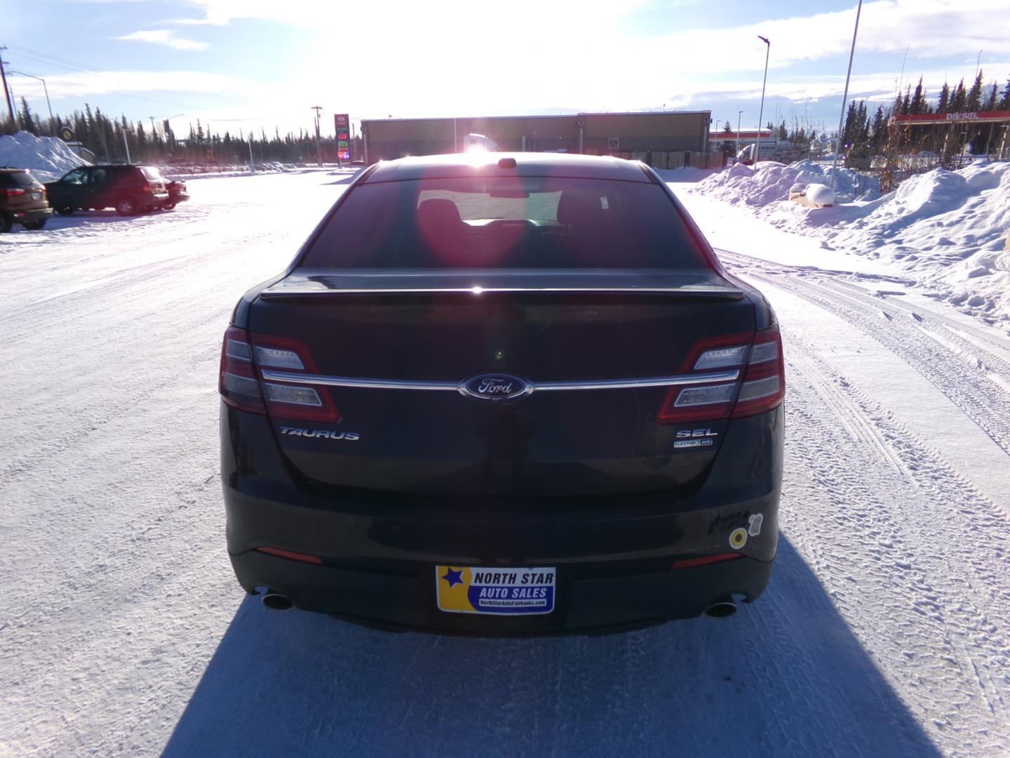 2014 Brown Ford Taurus SEL (1FAHP2H85EG) with an 3.5L V6 DOHC 24V engine, 6-Speed Automatic transmission, located at 2630 Philips Field Rd., Fairbanks, AK, 99709, (907) 458-0593, 64.848068, -147.780609 - Photo#3